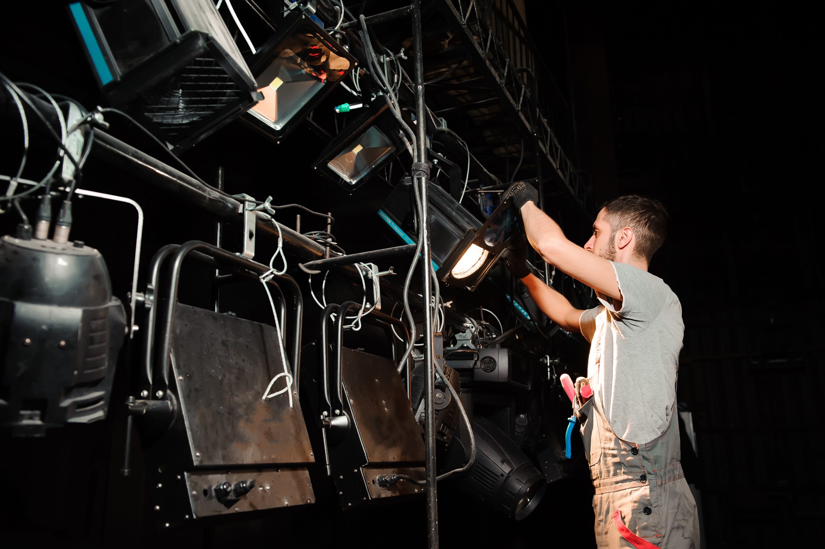 The stage worker sets up the lights